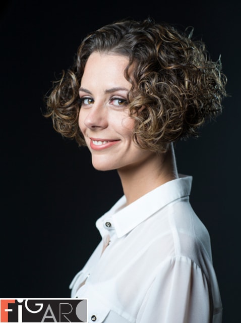 haircut for medium curly hair by award wining stylist Elena Bogdanets Toronto